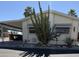 Charming single-story home with a covered carport and desert landscaping at 17200 W Bell Rd # 1551, Surprise, AZ 85374