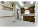 Bright kitchen features tile floors, wood cabinets, and white appliances at 17200 W Bell Rd # 1551, Surprise, AZ 85374