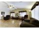 Spacious living room with vaulted ceilings, wood laminate flooring, and comfortable seating at 17200 W Bell Rd # 1551, Surprise, AZ 85374