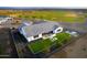 Overhead view of a home with a lush backyard, outdoor living space, and close proximity to a golf course at 17801 W Mountainair St, Surprise, AZ 85388