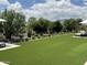 Expansive backyard featuring artificial turf, desert landscaping, and plenty of space for recreation at 17801 W Mountainair St, Surprise, AZ 85388
