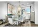 Elegant dining room with stylish decor, a modern chandelier, and ample natural light at 17801 W Mountainair St, Surprise, AZ 85388