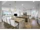 Modern kitchen with stainless steel appliances, granite countertops, and a large island at 17801 W Mountainair St, Surprise, AZ 85388