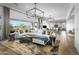 Spacious living area featuring modern decor, large windows, and seamless flow to the kitchen at 17801 W Mountainair St, Surprise, AZ 85388