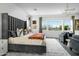Main bedroom features large windows and a luxury king bed with accent pillows at 17801 W Mountainair St, Surprise, AZ 85388