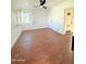 Bedroom with modern window shutters, wood-style flooring, and neutral paint at 1837 W Virginia Ave, Phoenix, AZ 85007