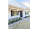 Charming home featuring a dark front door, black shutters, and manicured lawn at 1837 W Virginia Ave, Phoenix, AZ 85007