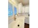 Bright kitchen features white shaker cabinets, subway tile backsplash, and stainless steel faucet at 1837 W Virginia Ave, Phoenix, AZ 85007