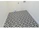 Modern laundry area with stylish black and white geometric tile floor at 1837 W Virginia Ave, Phoenix, AZ 85007