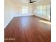 Spacious living room with tile floors and shuttered windows with lots of natural light at 1837 W Virginia Ave, Phoenix, AZ 85007