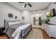 Comfortable bedroom with ceiling fan and en-suite bath and walk-in closet at 18919 W Verde Ln, Litchfield Park, AZ 85340