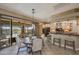 Dining area adjacent to kitchen featuring a cozy round table and access to the backyard at 18919 W Verde Ln, Litchfield Park, AZ 85340