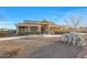 Beautiful single-story home with a desert landscape and a charming firepit for outdoor enjoyment at 18919 W Verde Ln, Litchfield Park, AZ 85340