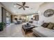 Spacious living room with open layout, seamlessly connected to the kitchen and dining area at 18919 W Verde Ln, Litchfield Park, AZ 85340