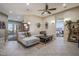 Comfortable living room featuring a large sectional sofa, neutral colors, and ample natural light at 18919 W Verde Ln, Litchfield Park, AZ 85340