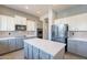 Kitchen features an island, stainless steel appliances, and tile backsplash at 1970 E Lafayette Ave, Gilbert, AZ 85298