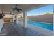 Covered patio with ceiling fans, an outdoor grill, and a view of the sparkling pool at 20709 N 56Th Dr, Glendale, AZ 85308