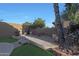 Spacious backyard patio with artificial turf, perfect for relaxation and entertaining guests at 20709 N 56Th Dr, Glendale, AZ 85308