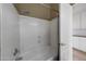 Functional bathroom featuring a shower-tub combo and white cabinets at 20709 N 56Th Dr, Glendale, AZ 85308