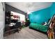Cozy bedroom featuring a large window, a black desk, and modern furniture at 20709 N 56Th Dr, Glendale, AZ 85308