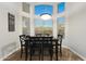 Dining area features a modern table setting bathed in natural light from surrounding windows at 20709 N 56Th Dr, Glendale, AZ 85308