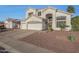 Stunning two-story stucco home with well-manicured desert landscaping and a spacious three car garage at 20709 N 56Th Dr, Glendale, AZ 85308