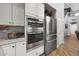 Modern kitchen with stainless steel appliances, including a double oven and refrigerator at 20709 N 56Th Dr, Glendale, AZ 85308