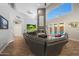 Spacious living room features a vaulted ceiling, fireplace, and doors to the backyard pool at 20709 N 56Th Dr, Glendale, AZ 85308