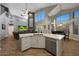 Spacious great room seamlessly connects to a modern kitchen and dining area with fireplace feature at 20709 N 56Th Dr, Glendale, AZ 85308