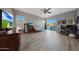 Open living area with a modern TV, sofa, and sliding glass doors leading to an outdoor view at 20709 N 56Th Dr, Glendale, AZ 85308