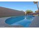 Refreshing pool with blue water, concrete border and a tall block wall for backyard privacy at 20709 N 56Th Dr, Glendale, AZ 85308