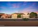 Scenic street view with attractive homes, lush landscaping, and mountain backdrop for tranquil living at 20709 N 56Th Dr, Glendale, AZ 85308