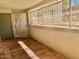 Enclosed patio area with tile flooring, security door, and natural light at 214 E Ruth Ave # 107, Phoenix, AZ 85020