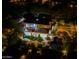 Aerial view of a luxury home highlighting the backyard pool, patio, outdoor kitchen, and landscape lighting at 22339 N 77Th Way, Scottsdale, AZ 85255