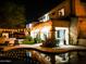Tranquil backyard at night with a sparkling pool, relaxing lounge chairs, and inviting outdoor lighting at 22339 N 77Th Way, Scottsdale, AZ 85255