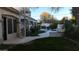 Landscaped backyard with an outdoor kitchen, pool and spa, spiral staircase, and mature trees at 22339 N 77Th Way, Scottsdale, AZ 85255