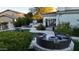Backyard oasis showcasing a pool, fire pit, lounging areas, and lush landscaping at 22339 N 77Th Way, Scottsdale, AZ 85255