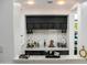 The bar features elegant stemware, decorative liquor bottles and marble countertops at 22339 N 77Th Way, Scottsdale, AZ 85255