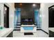 A spa-like bathroom featuring a fireplace, modern soaking tub, and dual walk-in showers at 22339 N 77Th Way, Scottsdale, AZ 85255