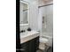 Modern bathroom featuring an illuminated mirror, marble countertop, and black showerhead at 22339 N 77Th Way, Scottsdale, AZ 85255