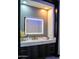 Modern bathroom with marble countertop, backlit mirror, and gray vanity at 22339 N 77Th Way, Scottsdale, AZ 85255