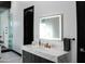 Bright bathroom with modern vanity, white marble countertops, a lighted mirror, and a glass-enclosed shower at 22339 N 77Th Way, Scottsdale, AZ 85255