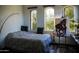 Comfortable bedroom with natural light, a cozy bed, and an easel featuring artwork at 22339 N 77Th Way, Scottsdale, AZ 85255