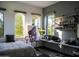Cozy bedroom with abundant natural light, an easel, and a comfortable bed at 22339 N 77Th Way, Scottsdale, AZ 85255