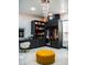 Organized walk-in closet featuring custom shelving, clothing racks, and vanity area with a tufted stool at 22339 N 77Th Way, Scottsdale, AZ 85255