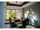 Elegant dining room with a modern chandelier, sleek furniture, and abundant natural light at 22339 N 77Th Way, Scottsdale, AZ 85255