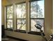 Exercise room with three large windows, an exercise bike, and natural lighting at 22339 N 77Th Way, Scottsdale, AZ 85255