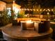 Inviting fire pit with stone surround and comfortable seating, ideal for outdoor gatherings at 22339 N 77Th Way, Scottsdale, AZ 85255