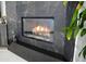 The fireplace is surrounded by dark marble, adding a touch of elegance to the room at 22339 N 77Th Way, Scottsdale, AZ 85255