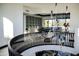 Bright game room with a pool table, lush plants, and views to the exterior at 22339 N 77Th Way, Scottsdale, AZ 85255